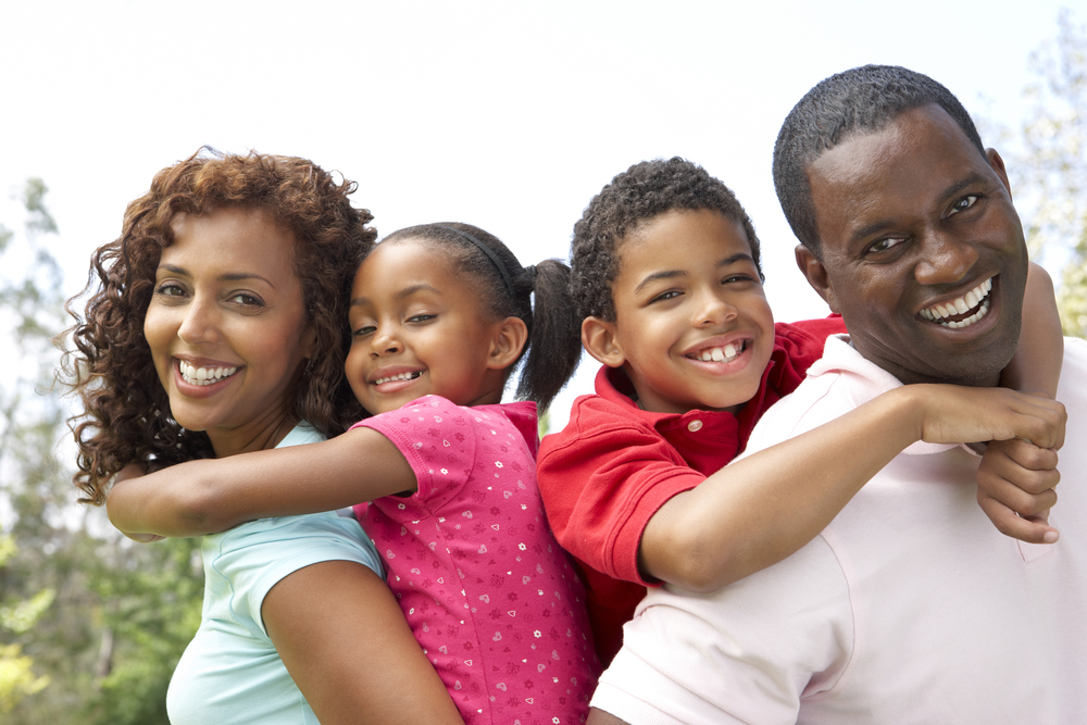 Portrait of Happy Family In Park